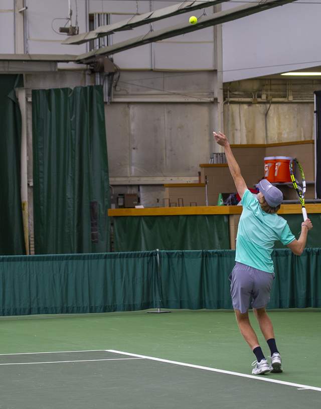 Tennis player serving the ball