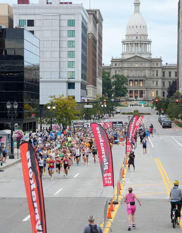 Capital City River Run in downtown Lansing with a view of the state capitol in the background.