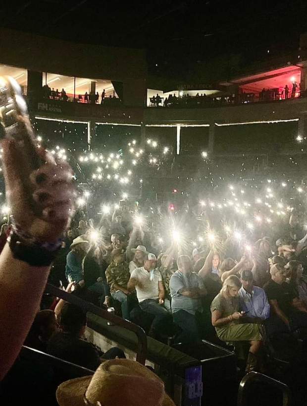 flashlights shine in a dark room