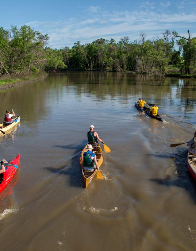 group paddling along the red river of the north