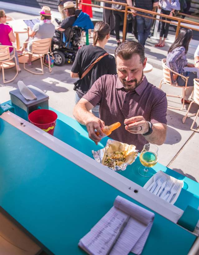man grabbing food from a food truck