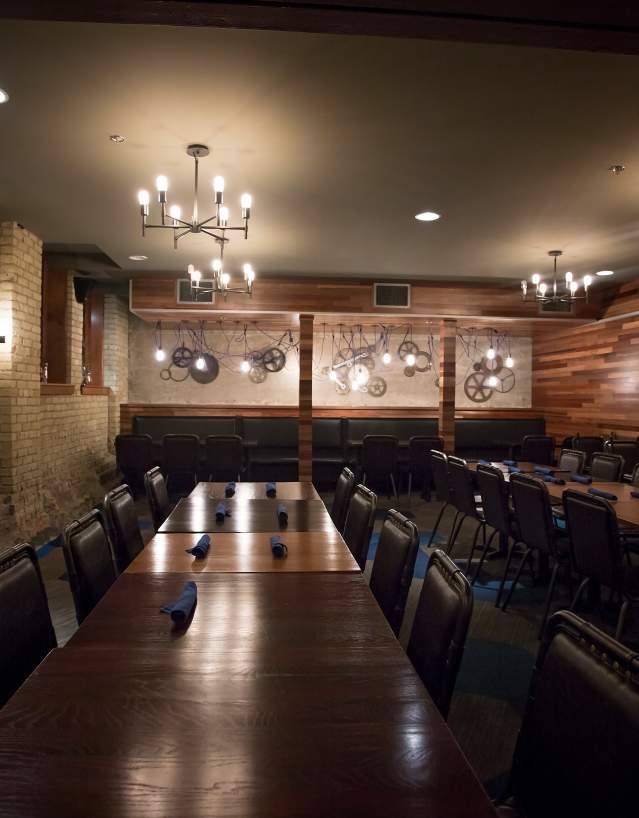 interior shot of a dark restaurant area with large tables