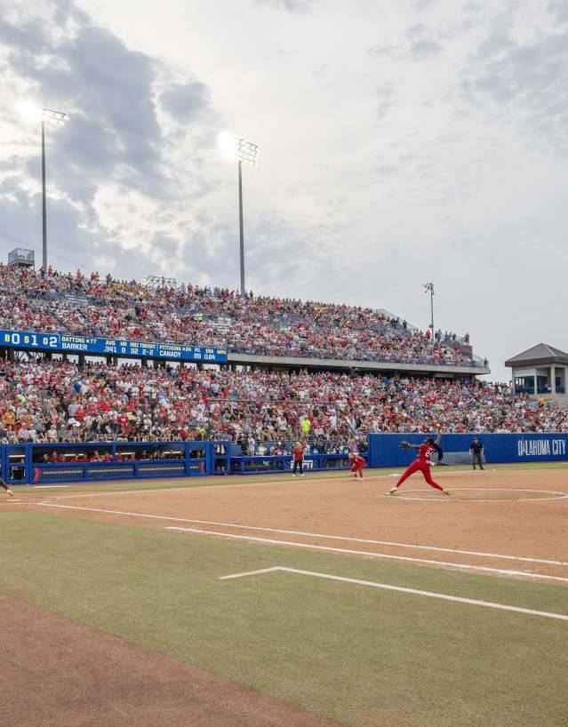 Women playing softball at Women's College World Series at Devon Park