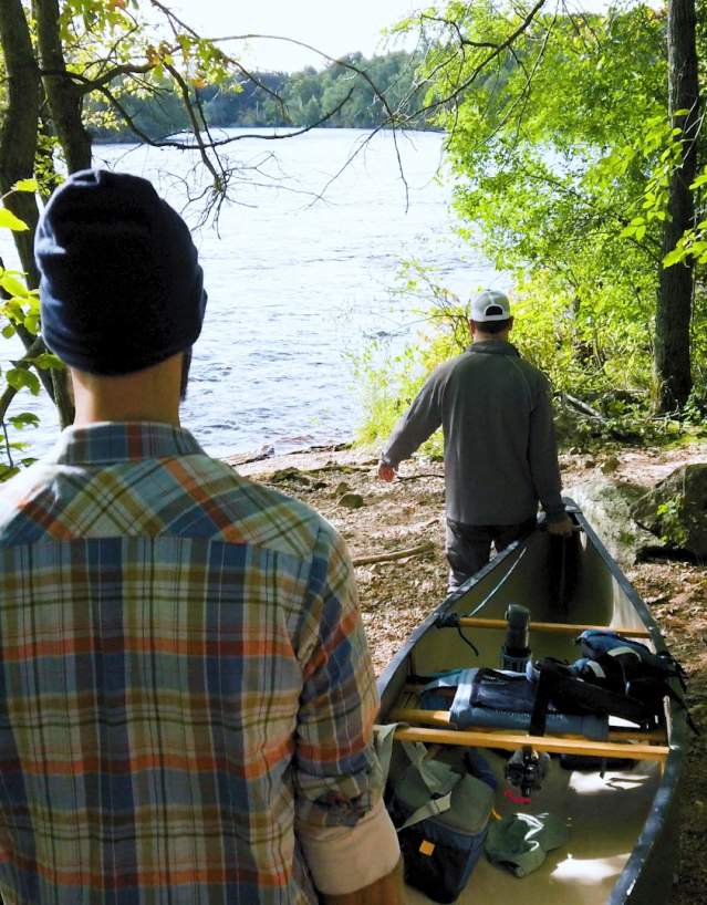 Timothy Bauer, writer for Miles Paddled, prepares to launch a canoe trip with a friend.