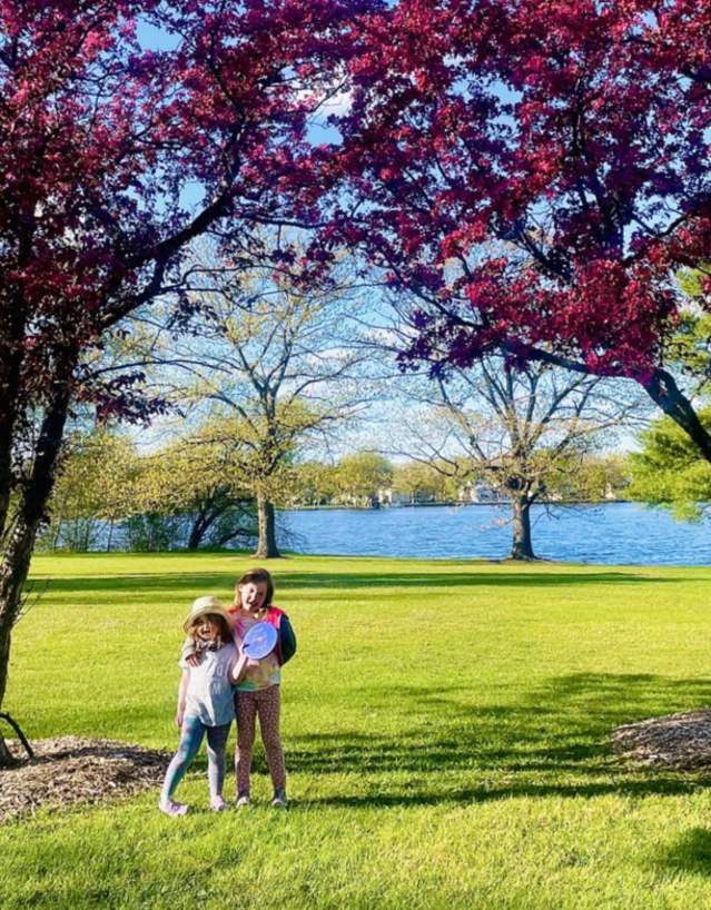 Two girls at the disc golf course at the Mead