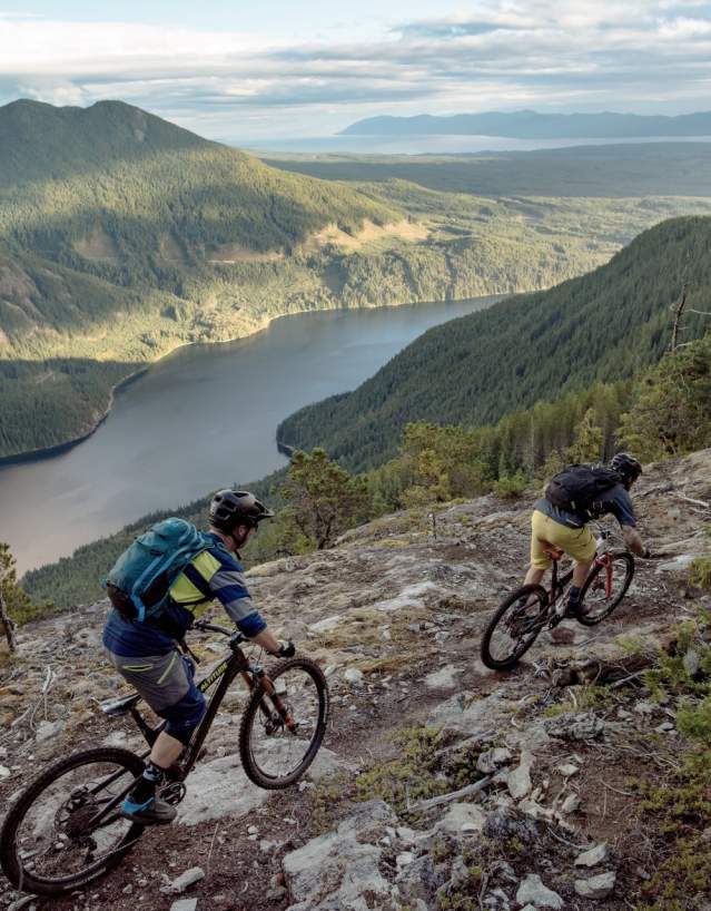 Mountain bikers ride a trail on Mt. Mahony that overlooks Haslam Lake.