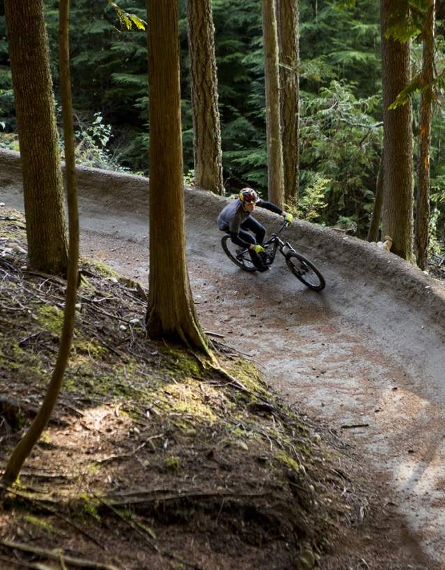 A mountain biker navigates a curve along the trail