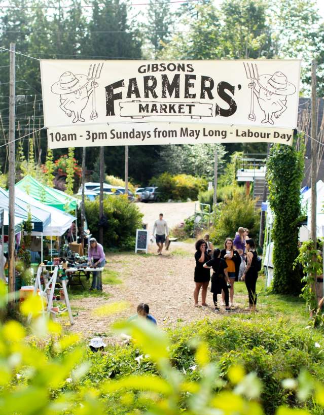 A view of the stalls and large event banner hanging near the entrance of the market.