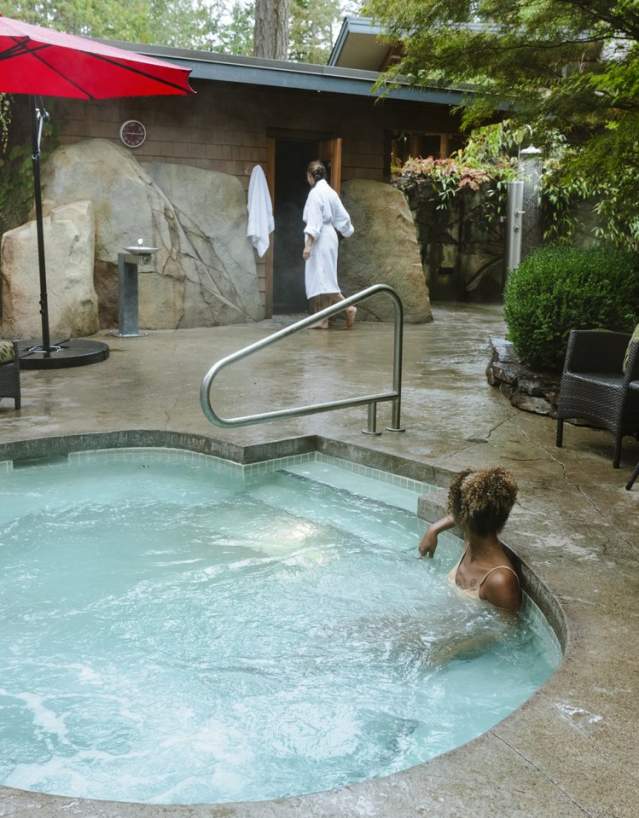 A woman sits in the hot tub at the spa.