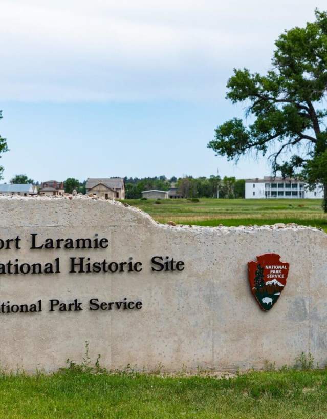Historic structures at Fort Laramie National Historic Site surrounded by open grasslands in Goshen County, Wyoming.