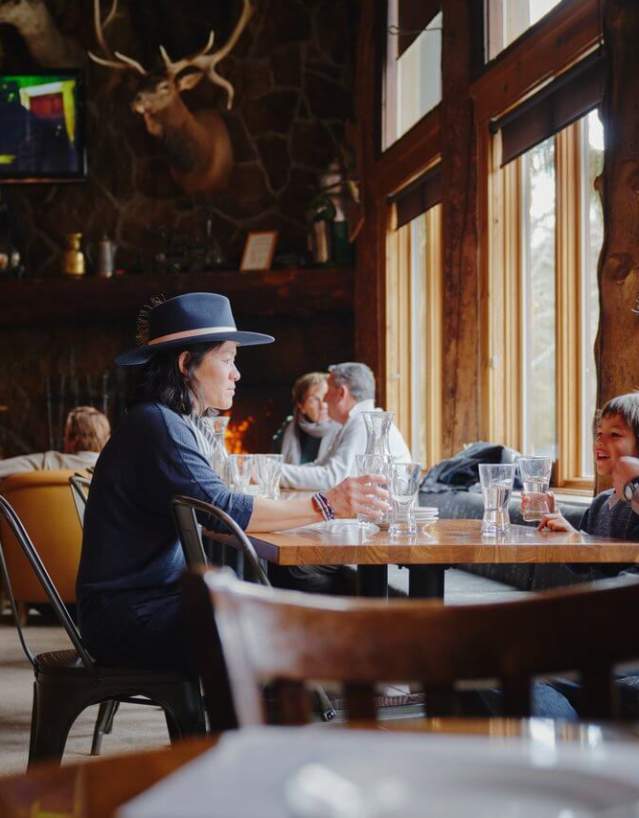 Bustling Teton Village restaurant with visitors in Teton County, Wyoming.