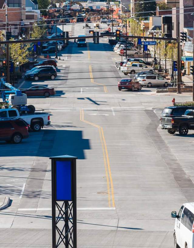 Lively downtown street in Gillette, Wyoming, lined with shops and historic buildings.