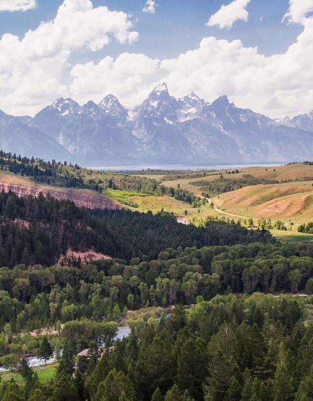 Scenic view of Grand Teton National Park with towering peaks and lush forests in Sublette County, Wyoming.