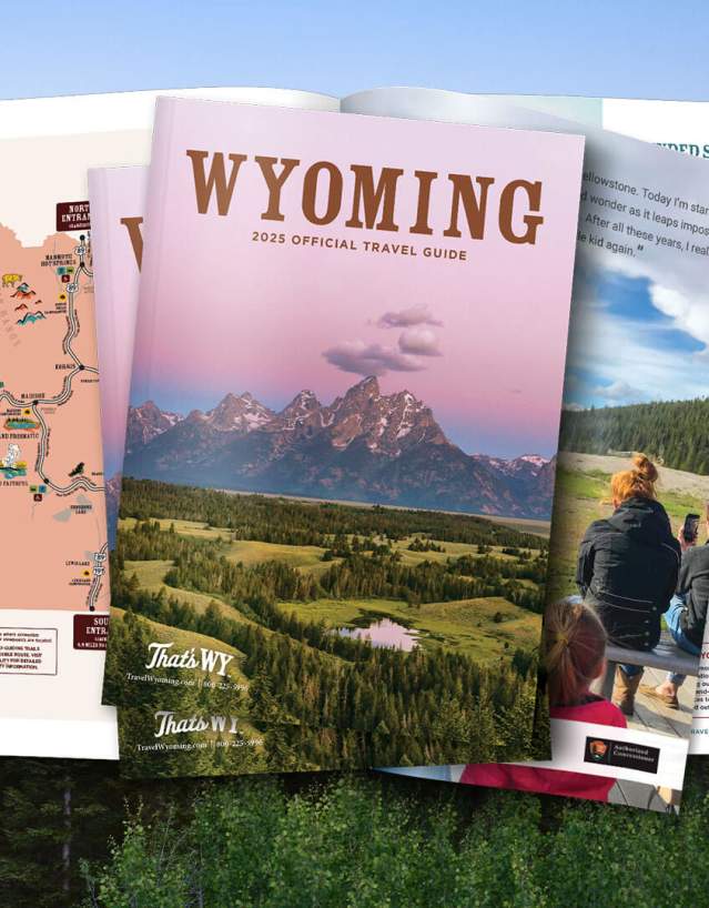an open printed guide showing Wyoming landscapes