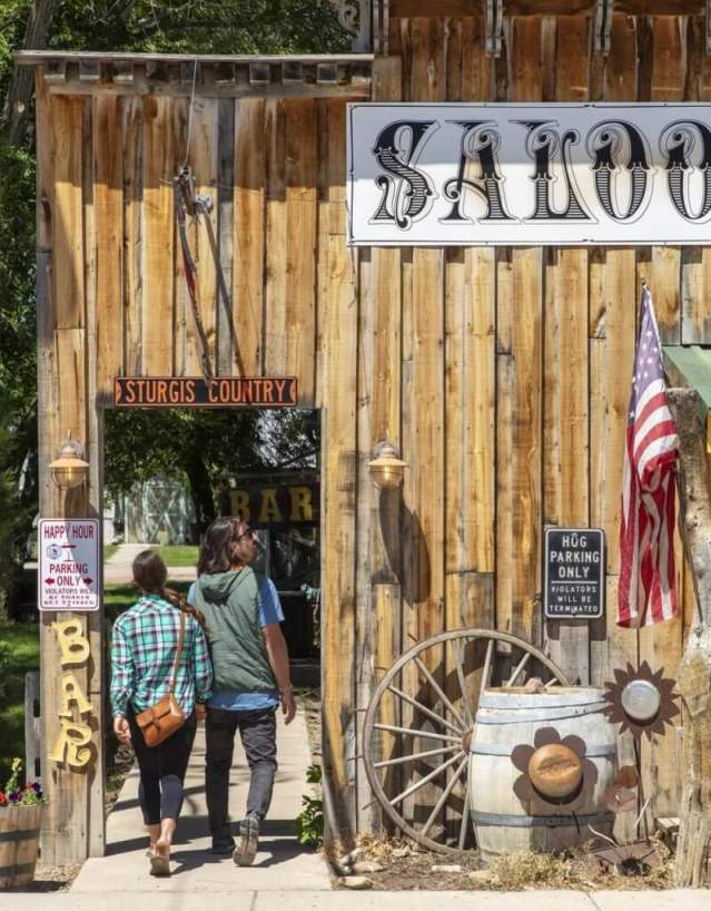 Tourists observing quirky saloon attraction in Hulett, in Crook County, Wyoming.