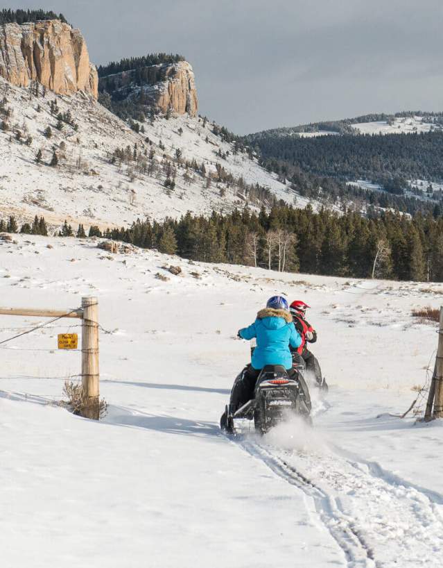 Snowmobile navigating a snowy trail in the Bighorn Mountains, Sheridan County, Wyoming.