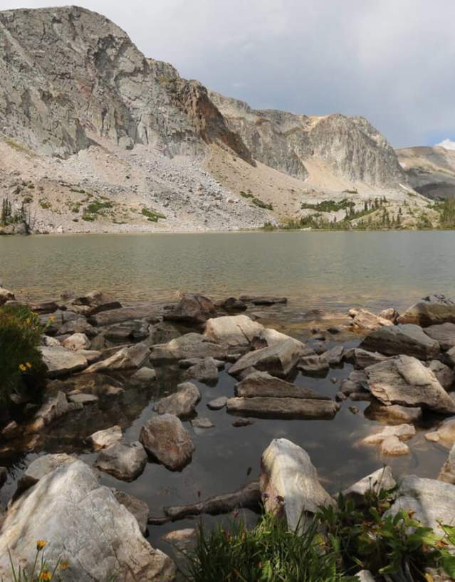 Snowy Range's Lake Marie surrounded by pine trees and rugged peaks in Albany County, Wyoming