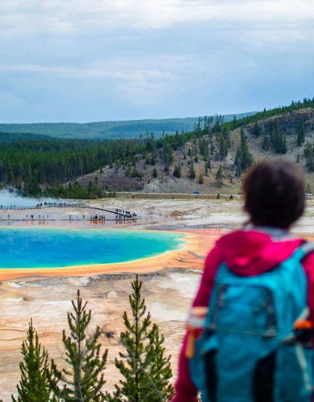 Expansive view of visitors viewing the Grand Prismatic spring in Yellowstone National Park.