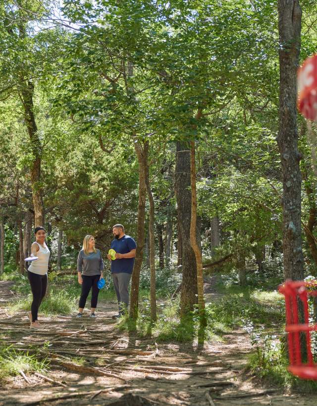 Friends playing Disc Golf