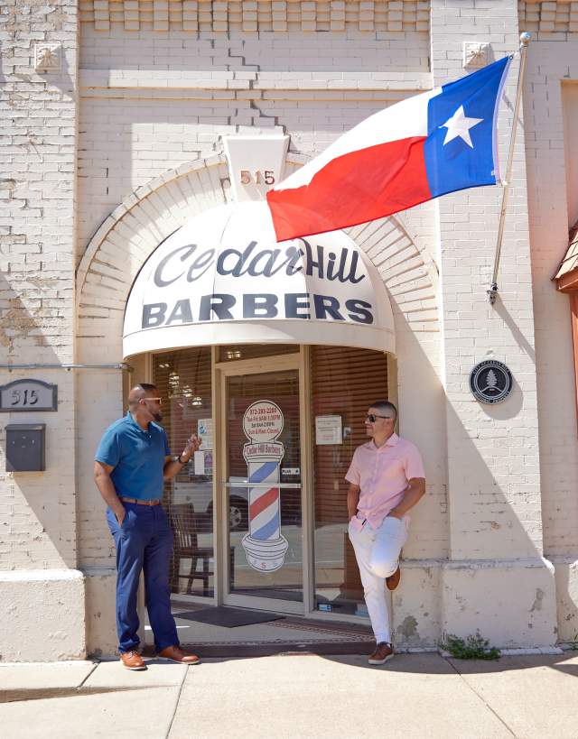 men in front of shop in downtown