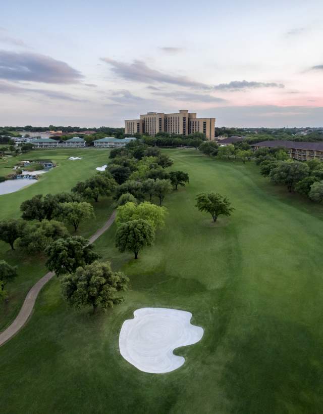 OVerhead View Of A Golf Course With The City Of Irving, TX In The Background