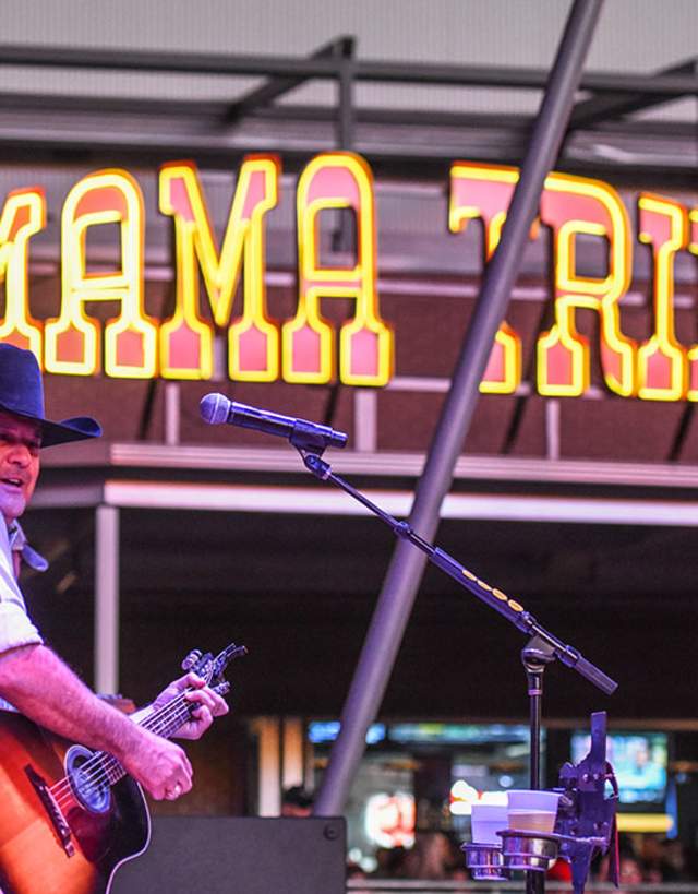 Music artist playing the guitar at Mama Tried in Irving, TX