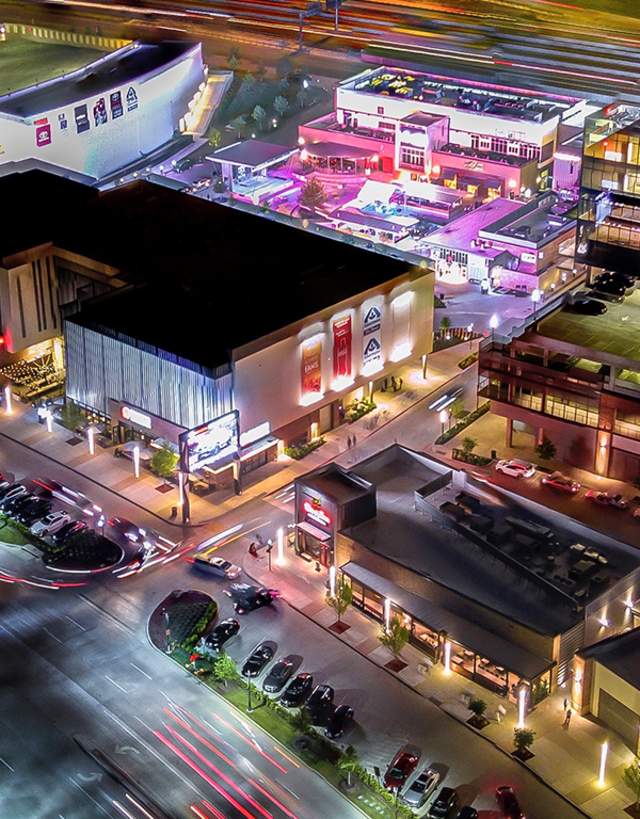 Aerial view of the Toyota Music Factory Entertainment District at night