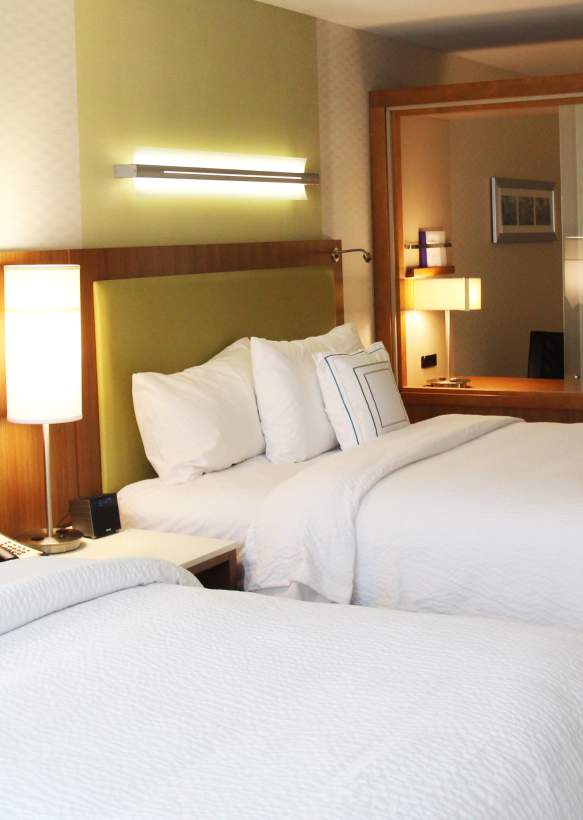 Two-queen hotel room in Bloomington