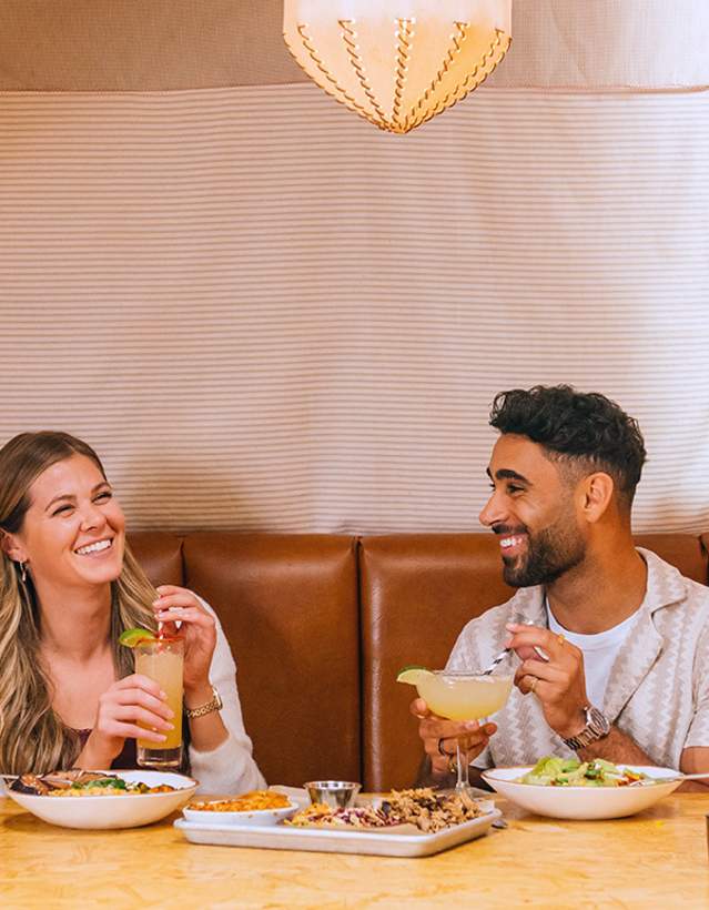 Couple eating in big booth at Union Rec