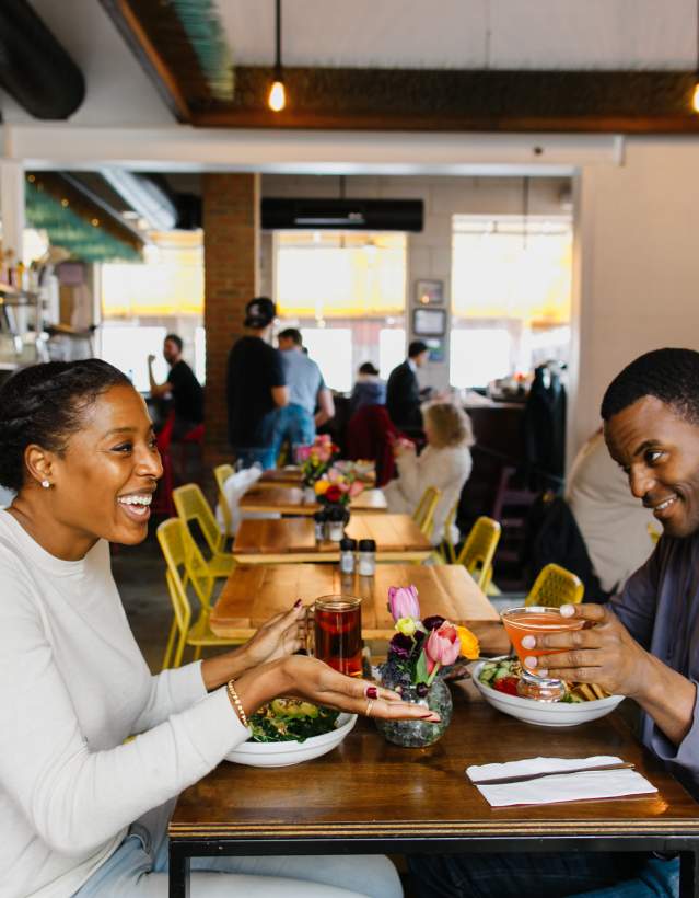 Couple sitting and dining at cafe