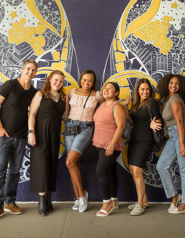 Group in front of Wings Mural