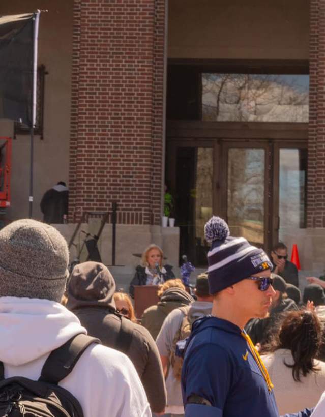 Crowd at Hash Bash with pot leaf flag