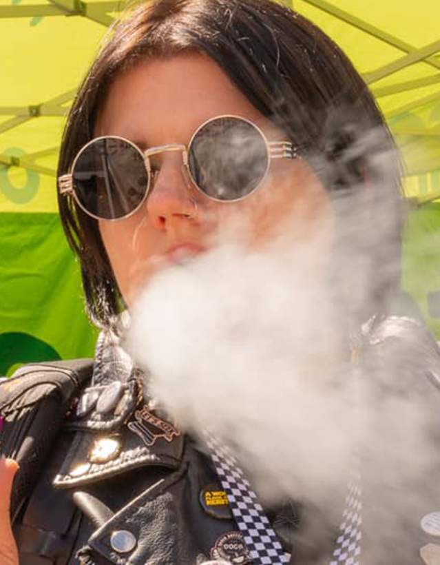 Woman smoking cannabis at Hash Bash
