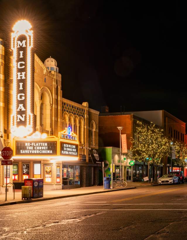 Lights on marquee of Michigan Theater at night