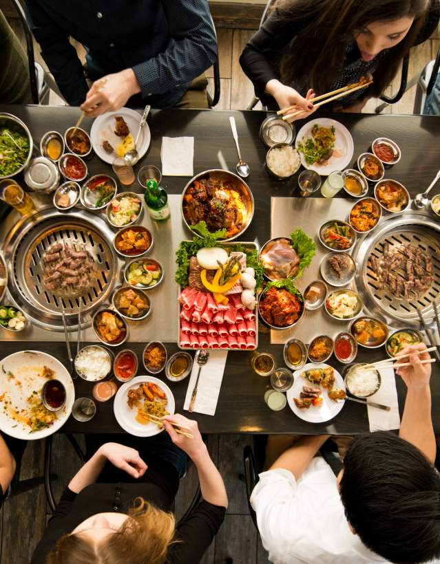 Above photo of group dining at korean BBQ
