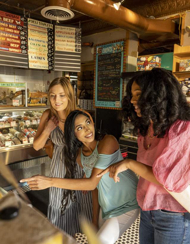 Three women at counter at Zingerman's Deli