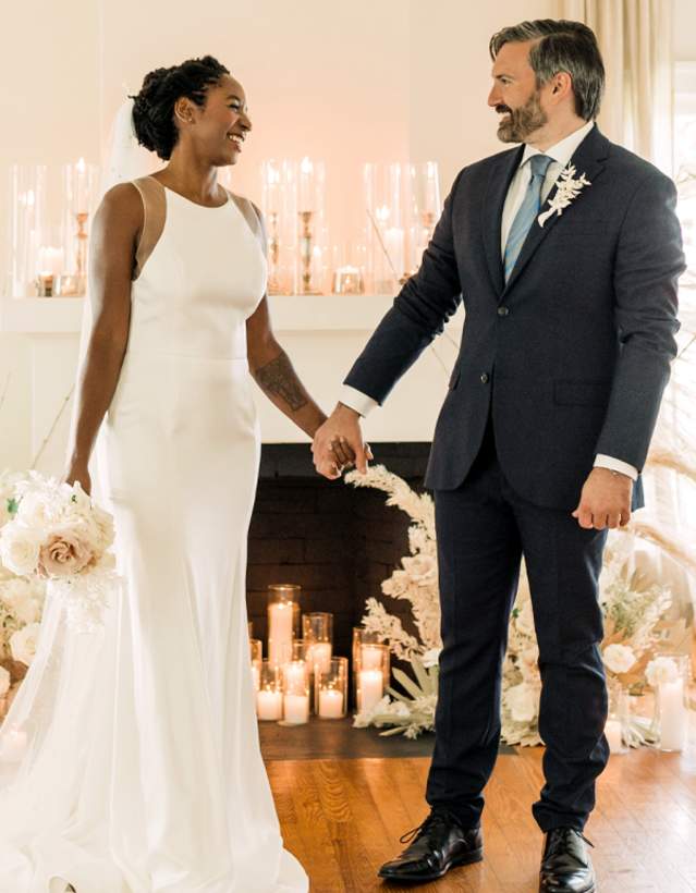 Couple holding hands at Tiny Wedding