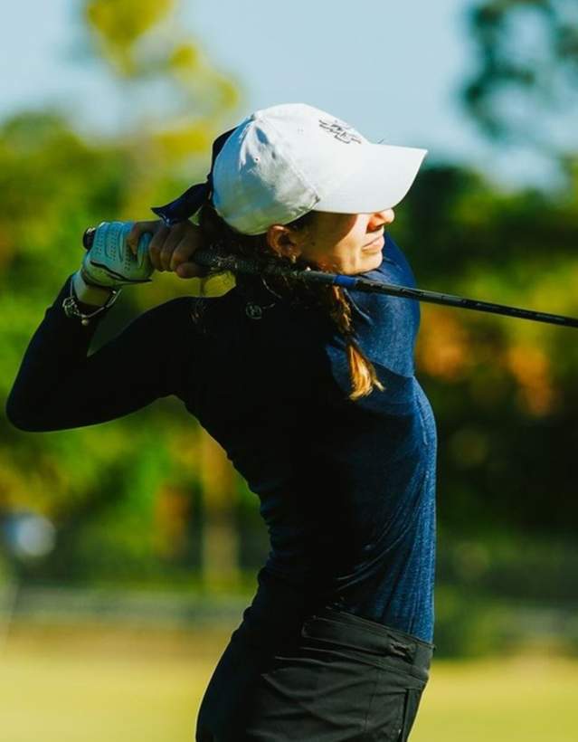 Carolin Alblas of Keiser (Fla.) after teeing off