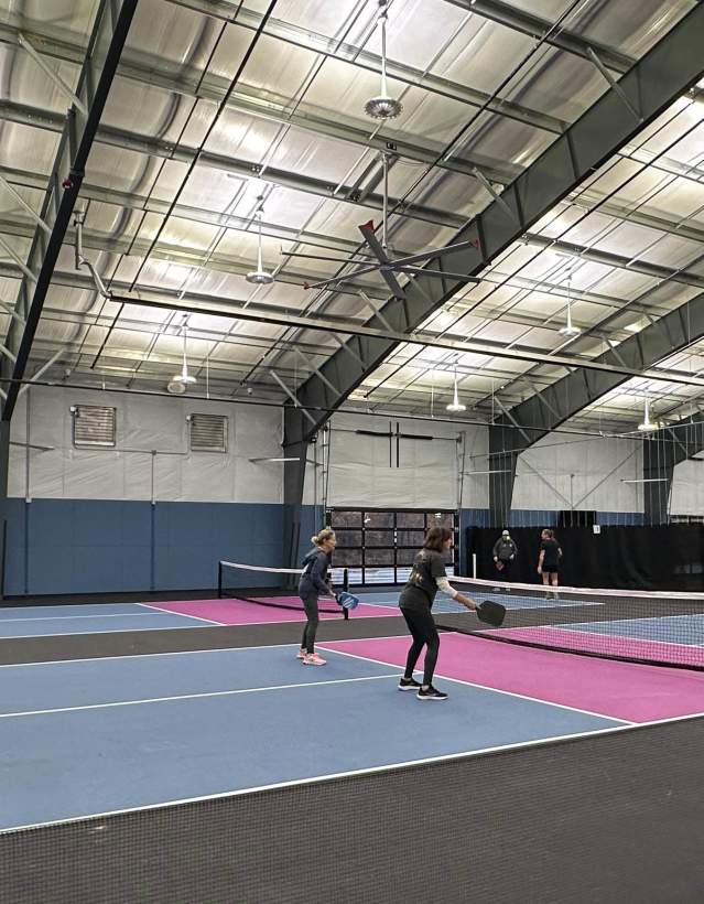 Group of people playing Pickleball on a court