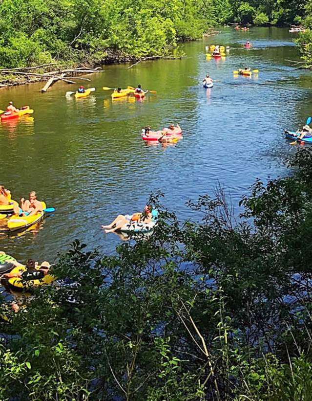 Group of kayakers on Huron River in summer