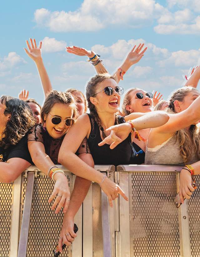 Crowd of young women against the festival barricade in front of stage at ACL Music Festival