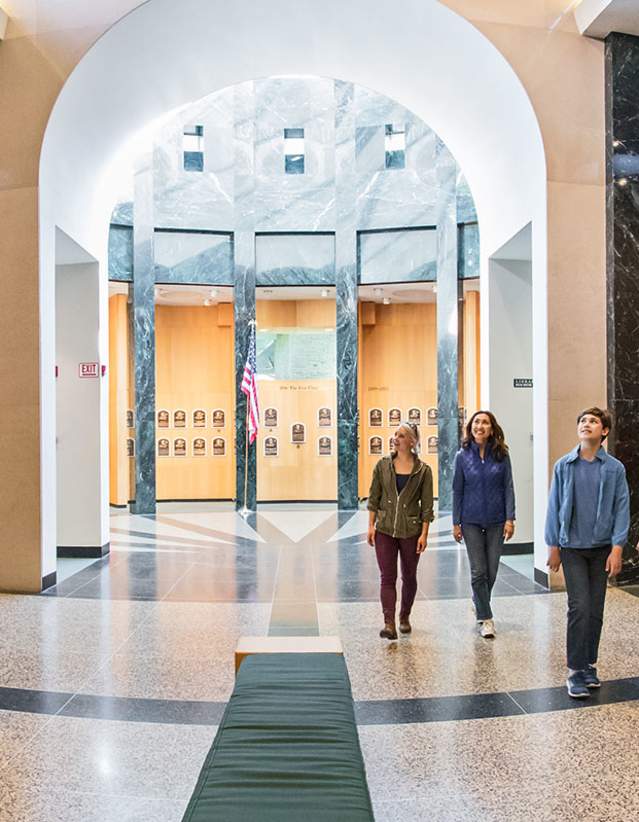 Family walking through the Plaque Gallery at the National Baseball Hall of Fame