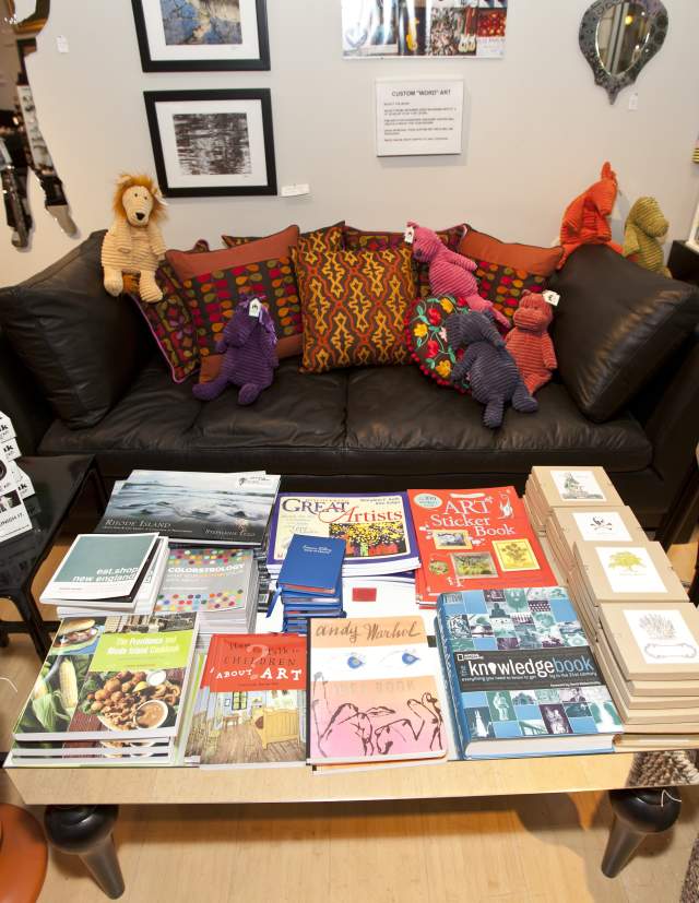 Books, games, artwork and a seating area in a Providence RI store