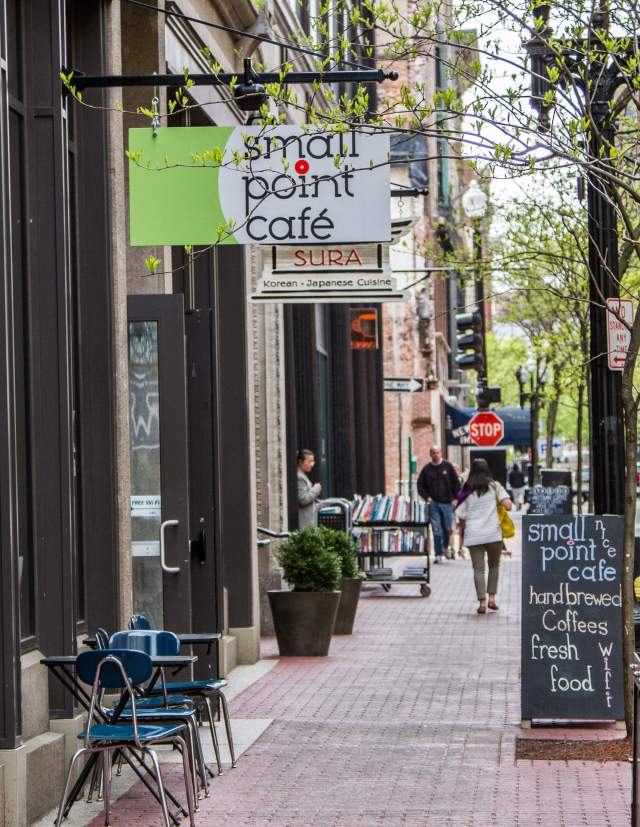 Shoppers stroll past popular boutiques on Westminster Street in Providence