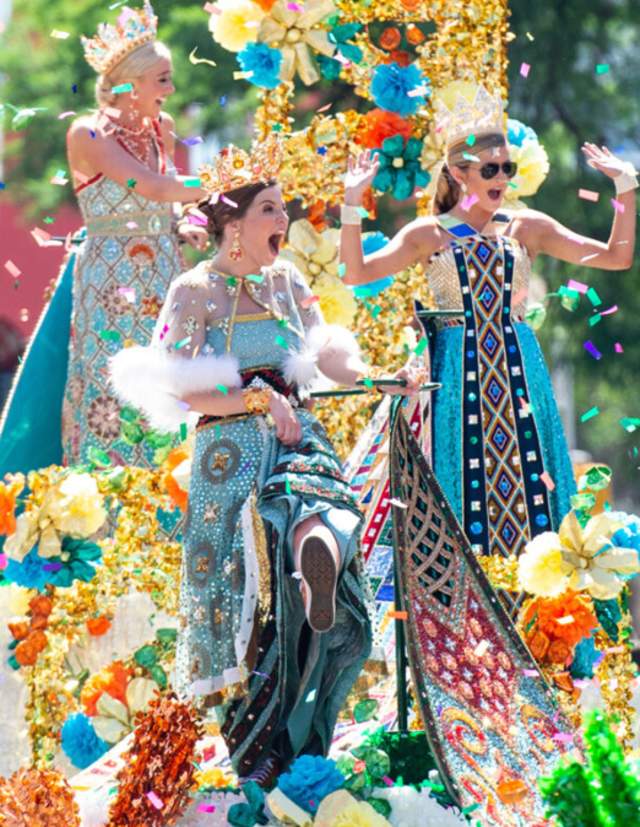 Fiesta Royalty on parade float surrounded by confetti