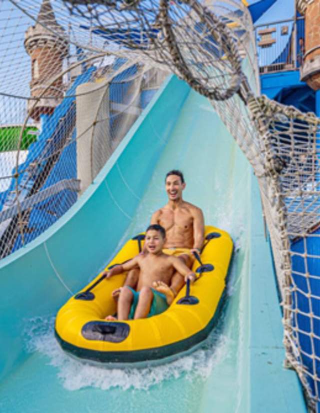 Father and son on waterslide