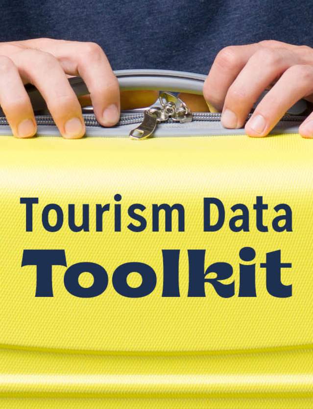 Hands on suitcase with Tourism Data Toolkit