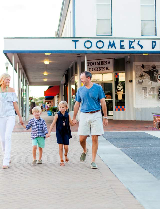 Family in fornt of Toomers Corner
