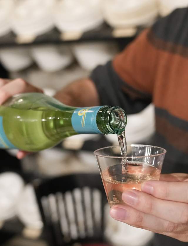 man pouring wine