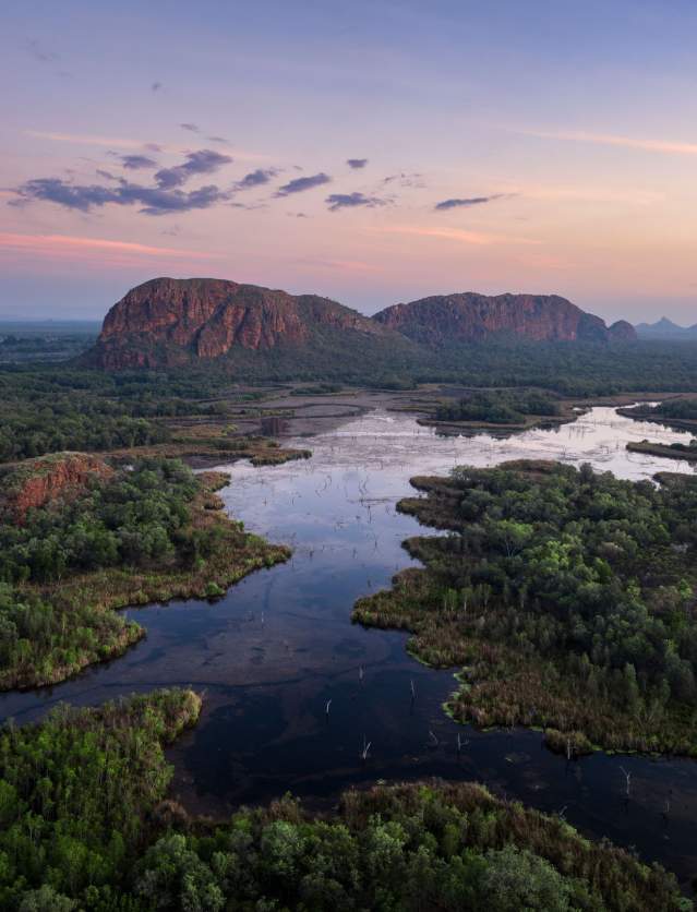 Kununurra waterways with the scenic rock formation known as Sleeping Buddha in the background. The photo is taken in the changing morning light.